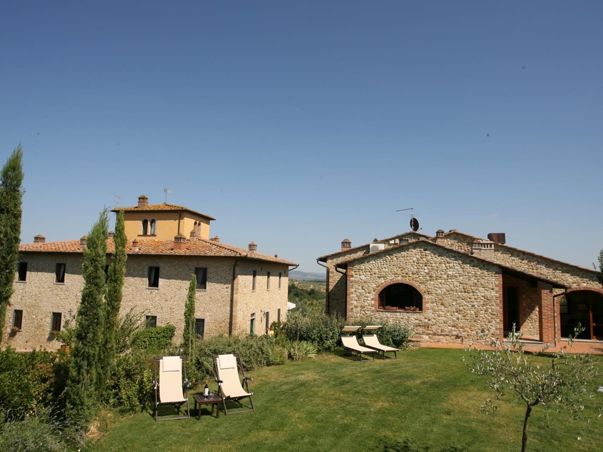 Exterior of property with garden in foreground at Villa Il Sole in Tuscany