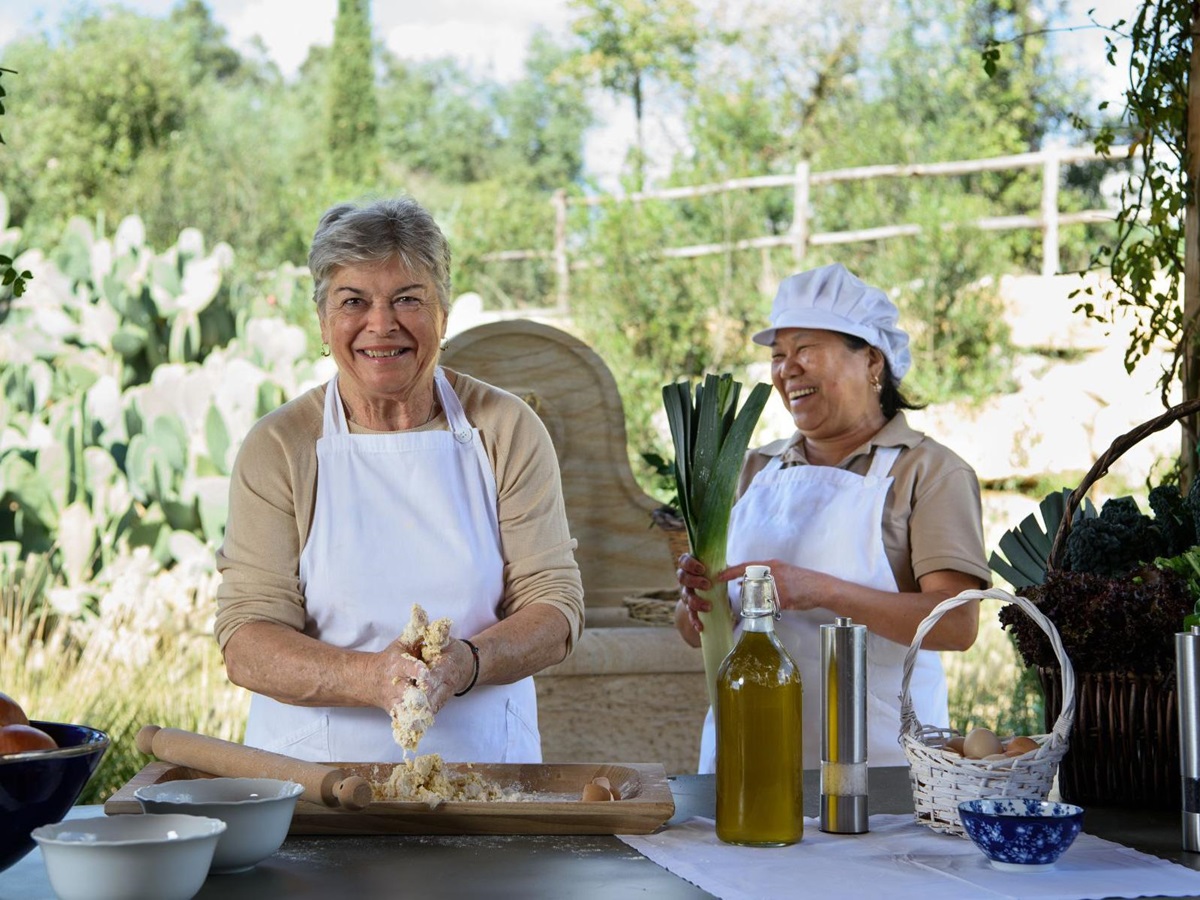 Chefs preparing food at Villa Jacaranda in Tuscany