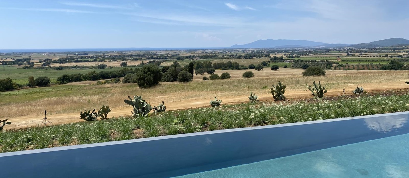 Pool with sea and countryside view at Villa Jacaranda in Tuscany, Italy