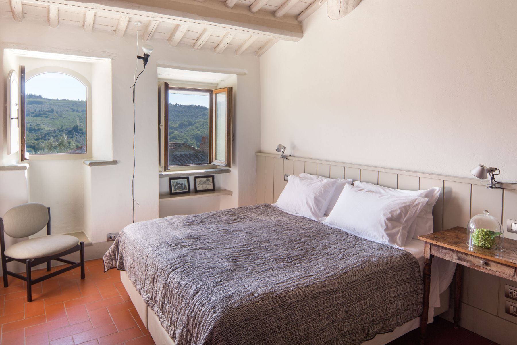 Bedroom with large double bed and modern decor at Villa Luce in Tuscany