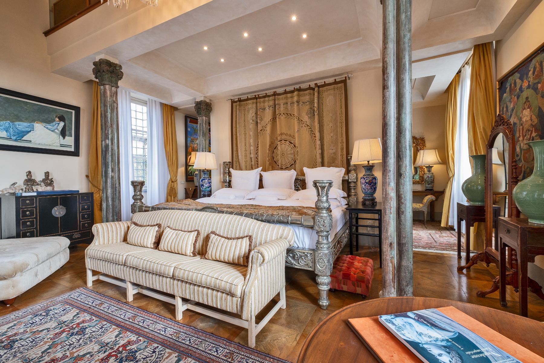 Large bedroom with king size bed and antique furniture at Villa Machiavelli in Tuscany