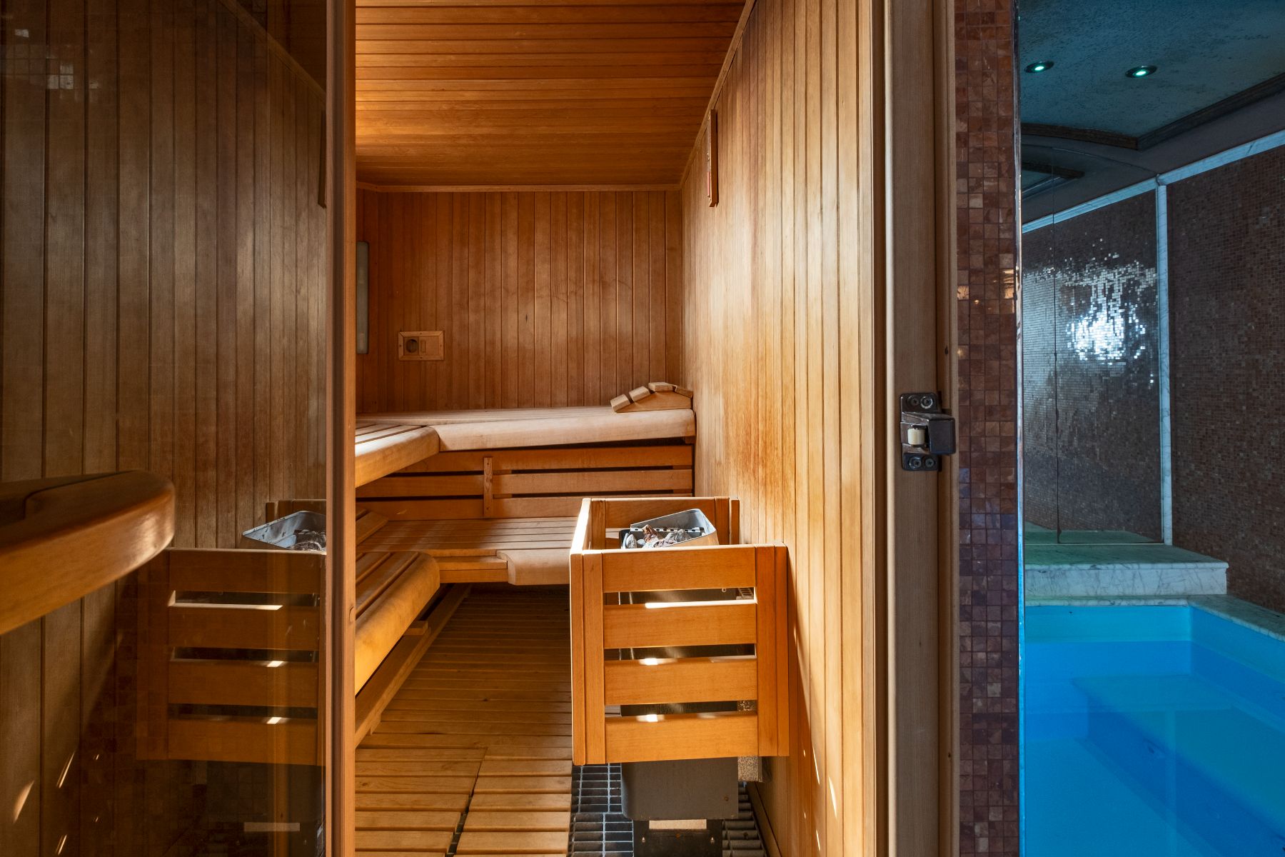 Indoor wooden sauna room next to swimming pool at Villa Machiavelli in Tuscany