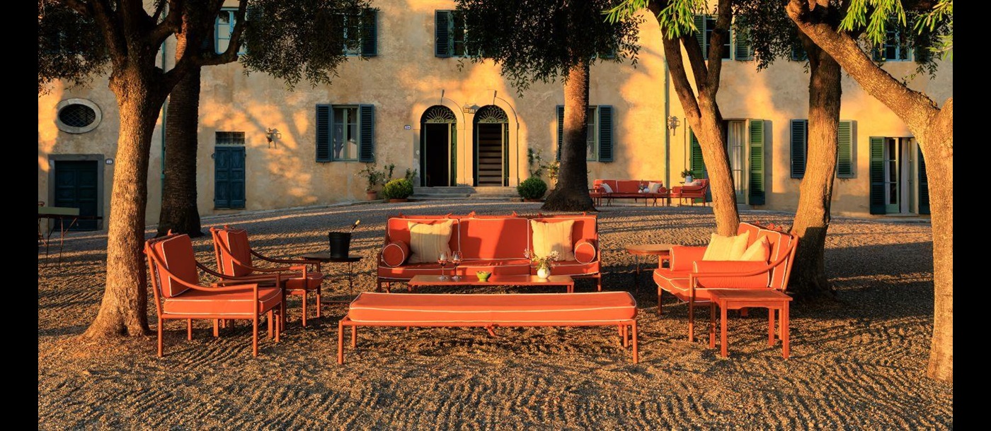 Exterior view of Villa Montecristo and outdoor seating 