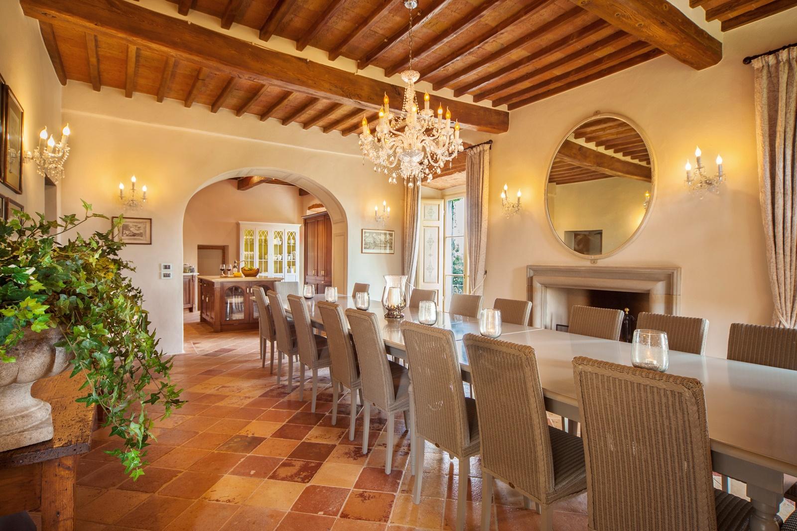 Well lit open dining room with chandelier in Villa Nocciola, Tuscany