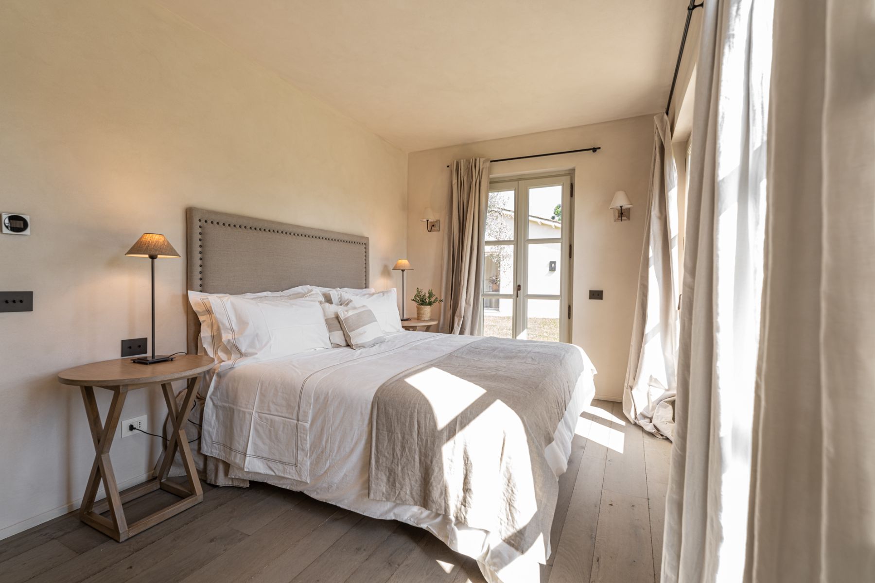 Bedroom with brown blanket in Villa Pedemontana in Tuscany