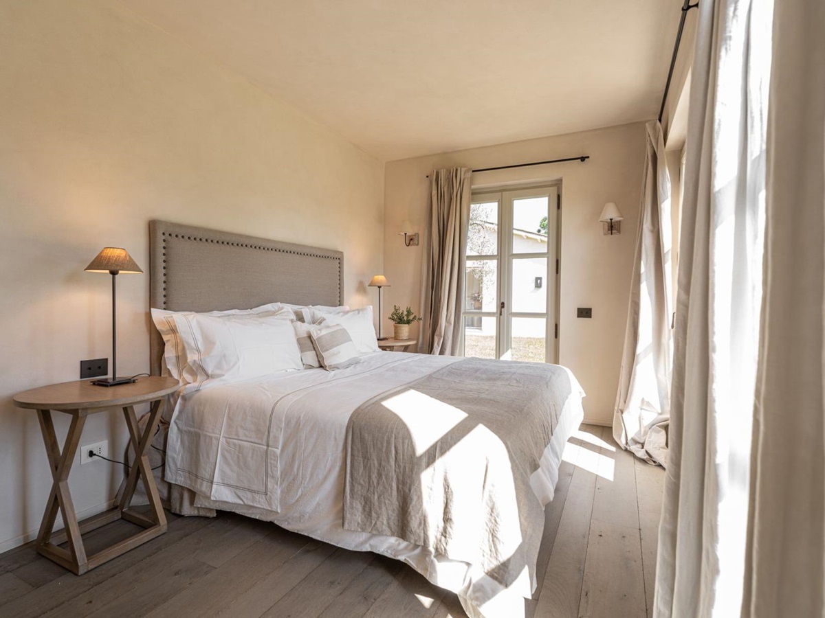 Bedroom with brown blanket in Villa Pedemontana in Tuscany