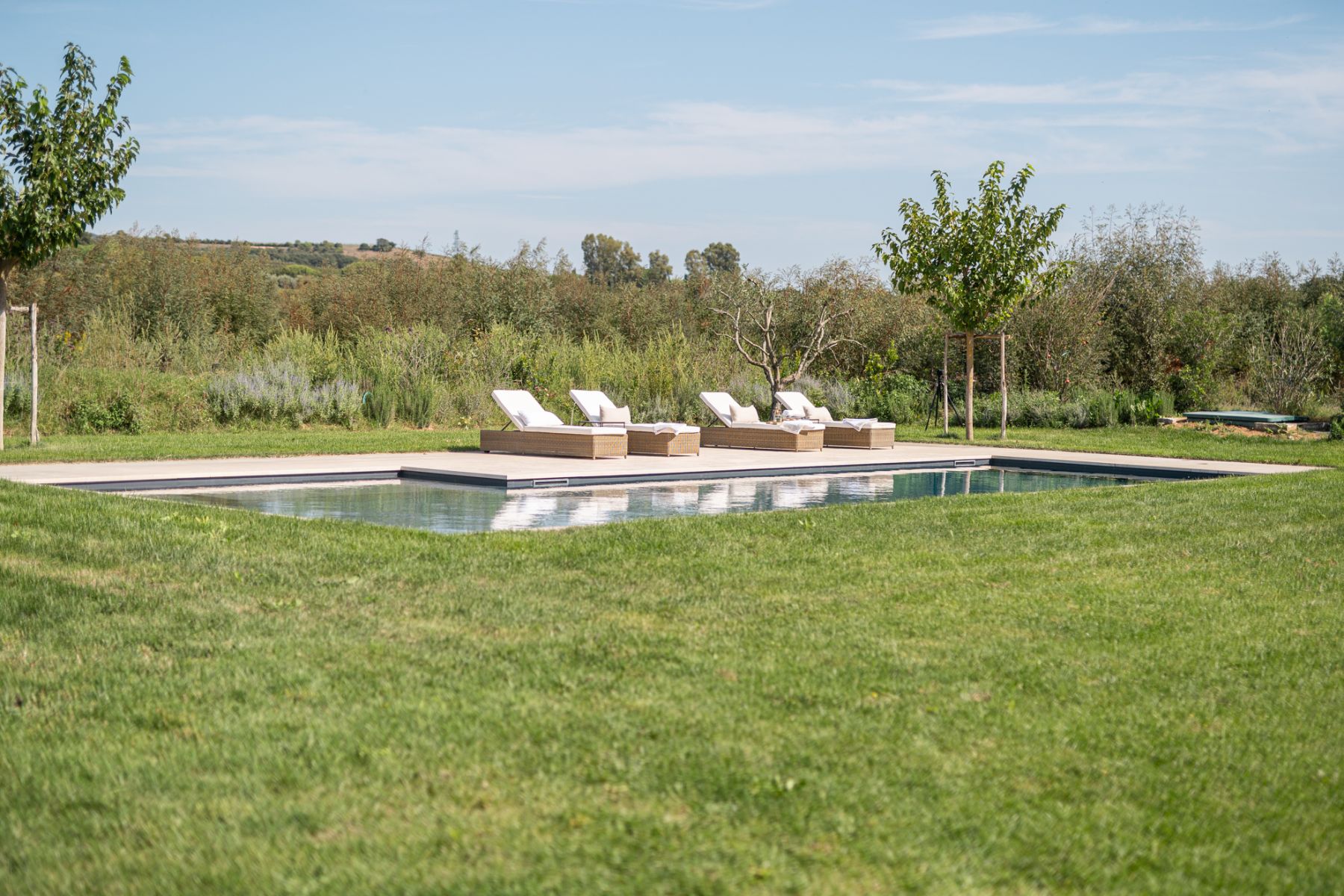 Pool and deck chairs in Villa Pedemontana in Tuscany