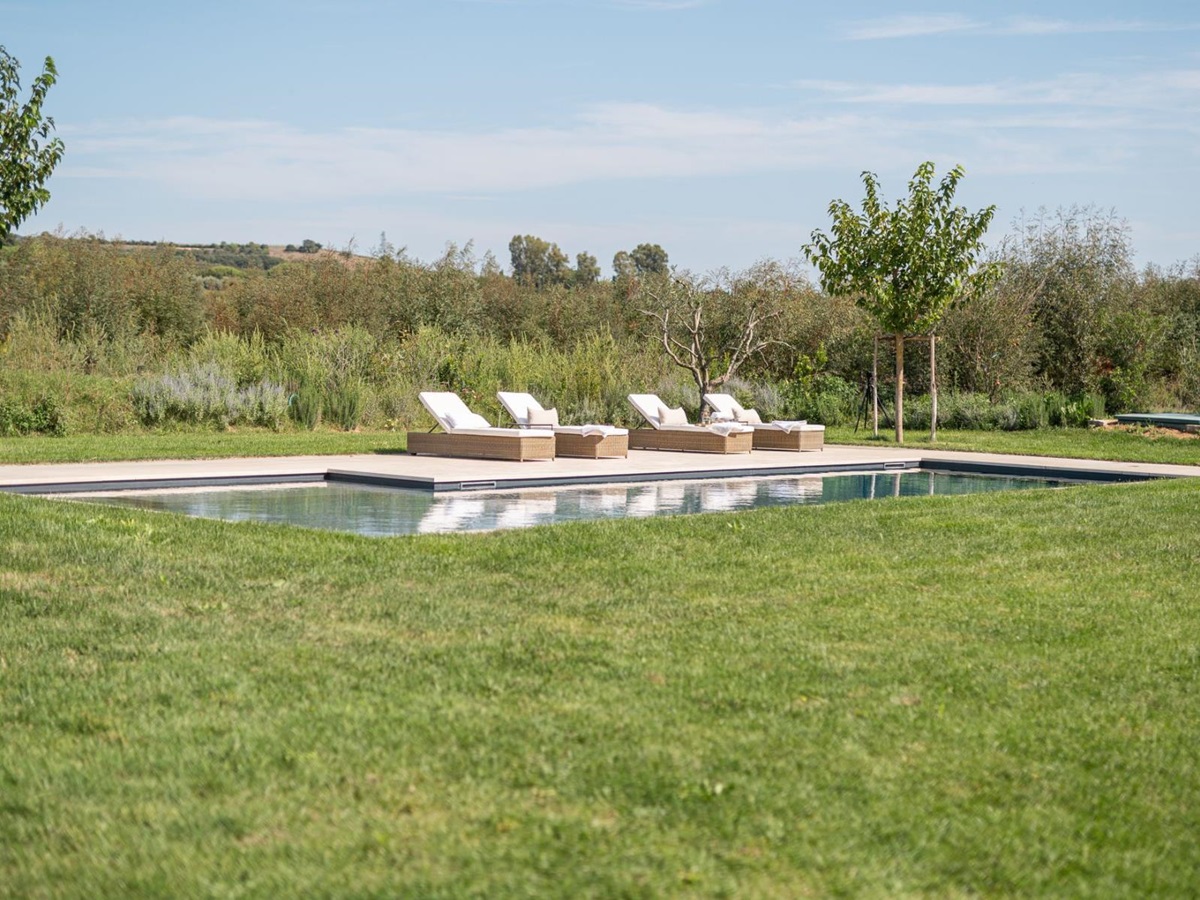 Pool and deck chairs in Villa Pedemontana in Tuscany