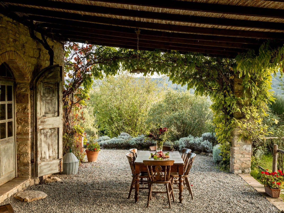 Outdoor dining table next to the villa doors at Villa San Barberino in Tuscany