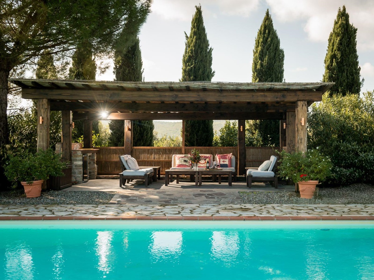 Outdoor pool area overlooking the lounge seating at Villa San Barberino in Tuscany