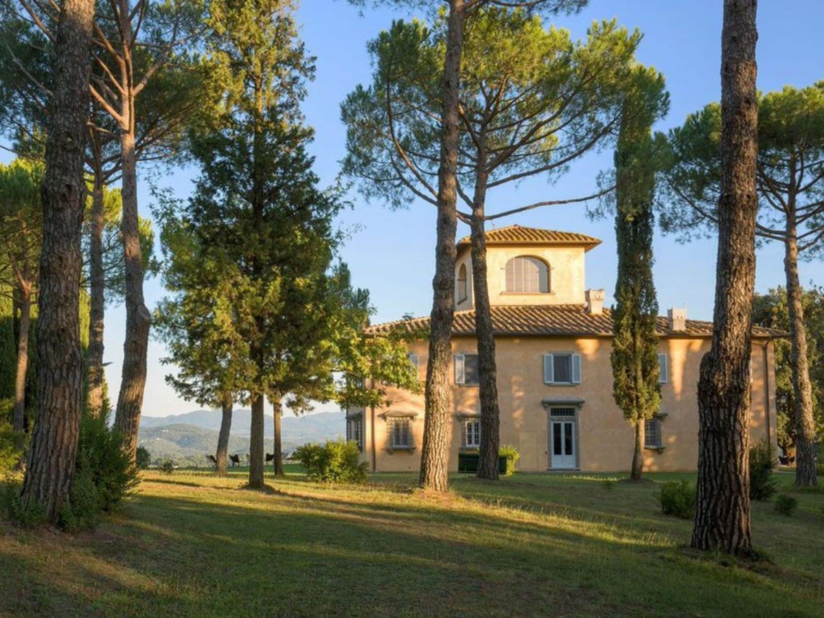 Garden view of Villa San Morello in Tuscany, surrounded by trees