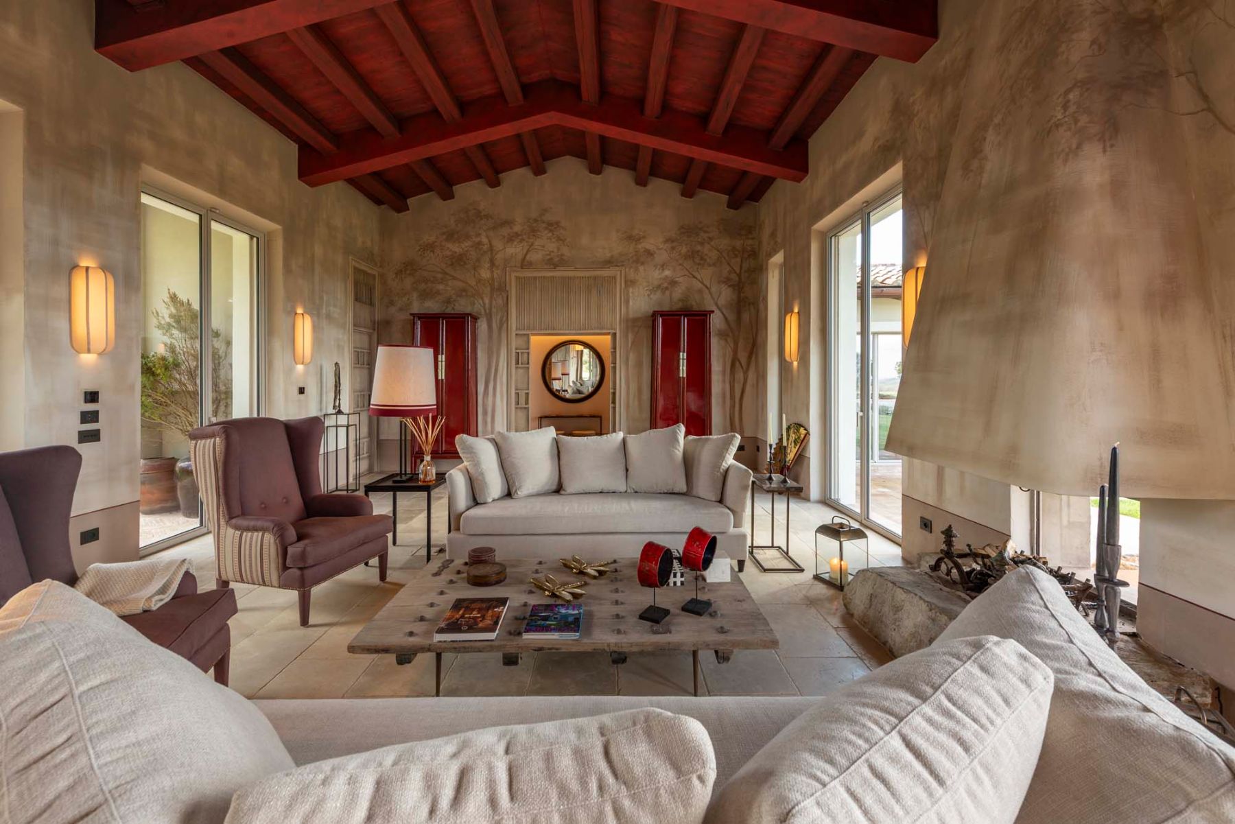 Living room with fireplace at Villa Tenerezza in Tuscany
