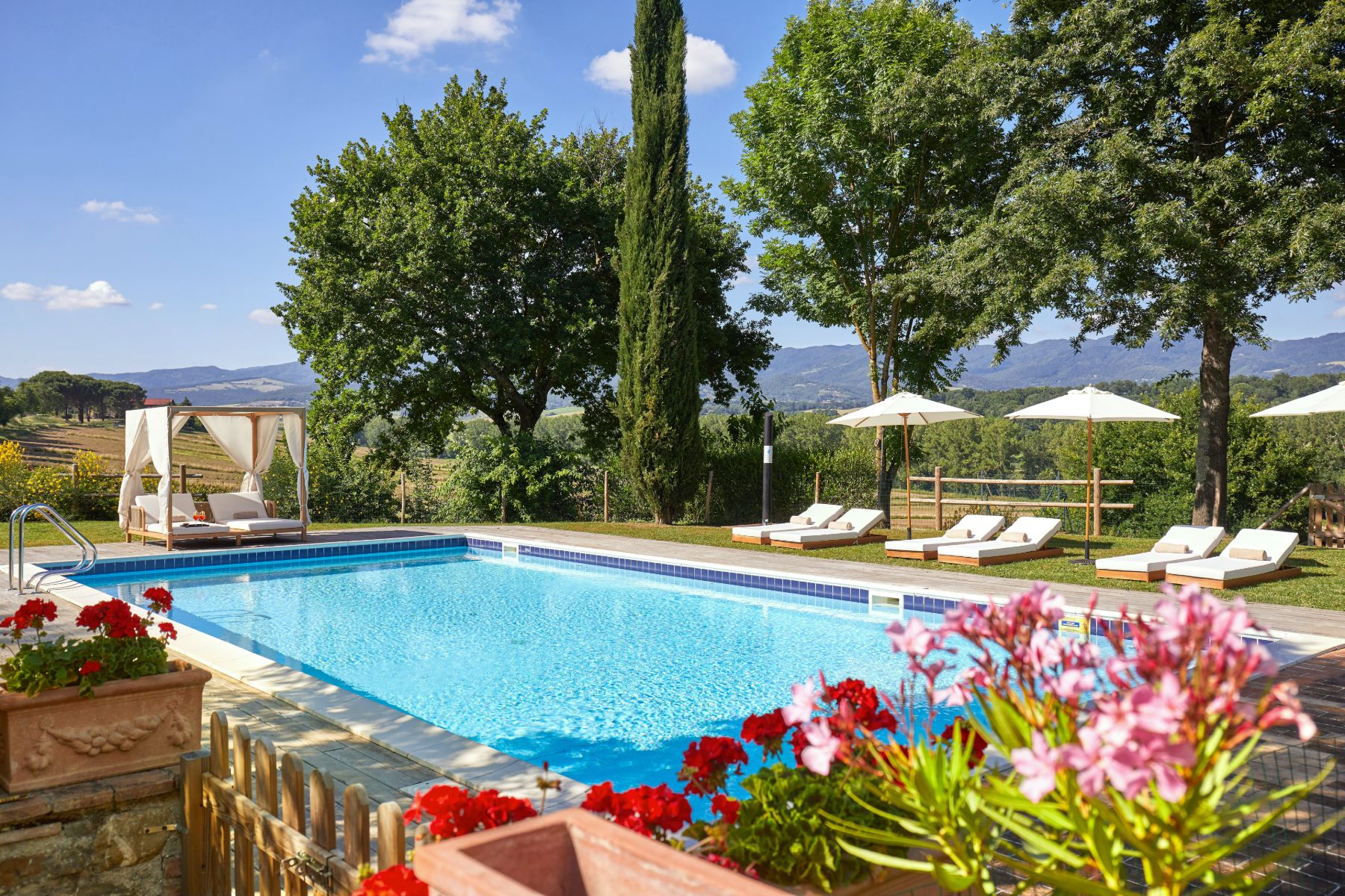 Swimming pool and flowers at Villa Tuori in Tuscany