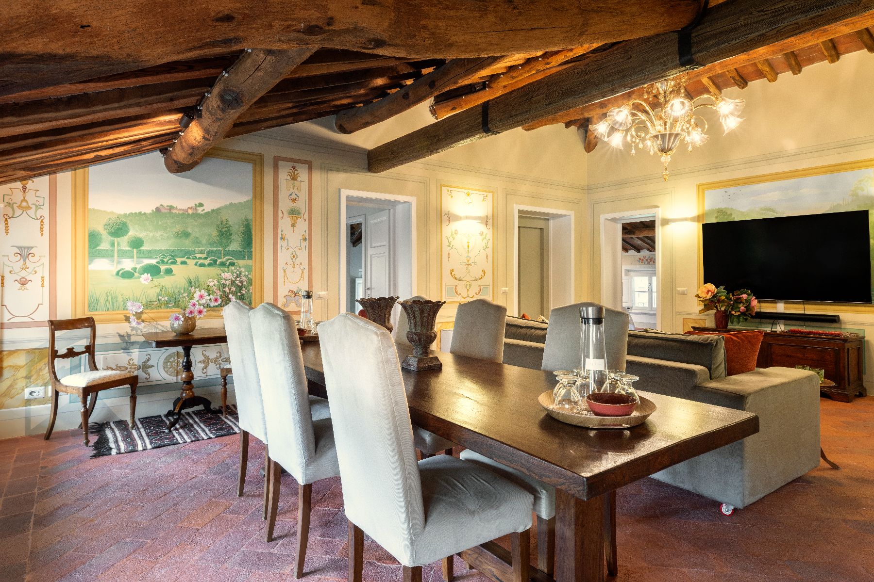 Dining table and lounge area at Villa Vorno in Tuscany