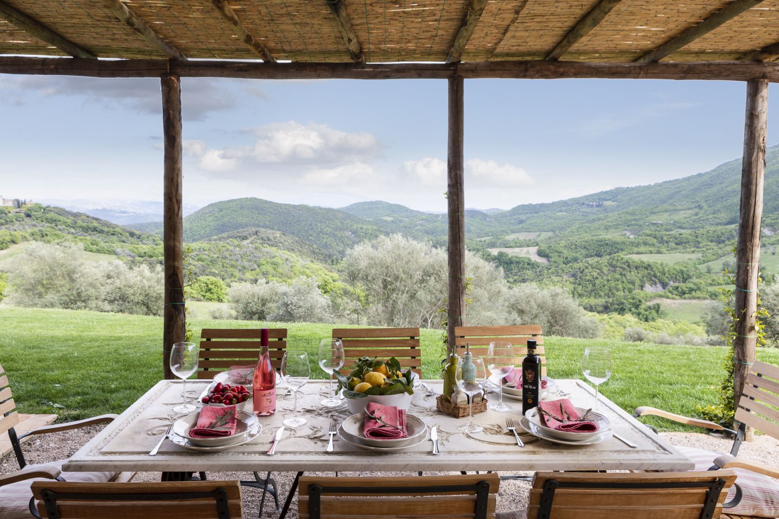 Dinner setup outside with a stunning view at Bel Canto, Umbria 