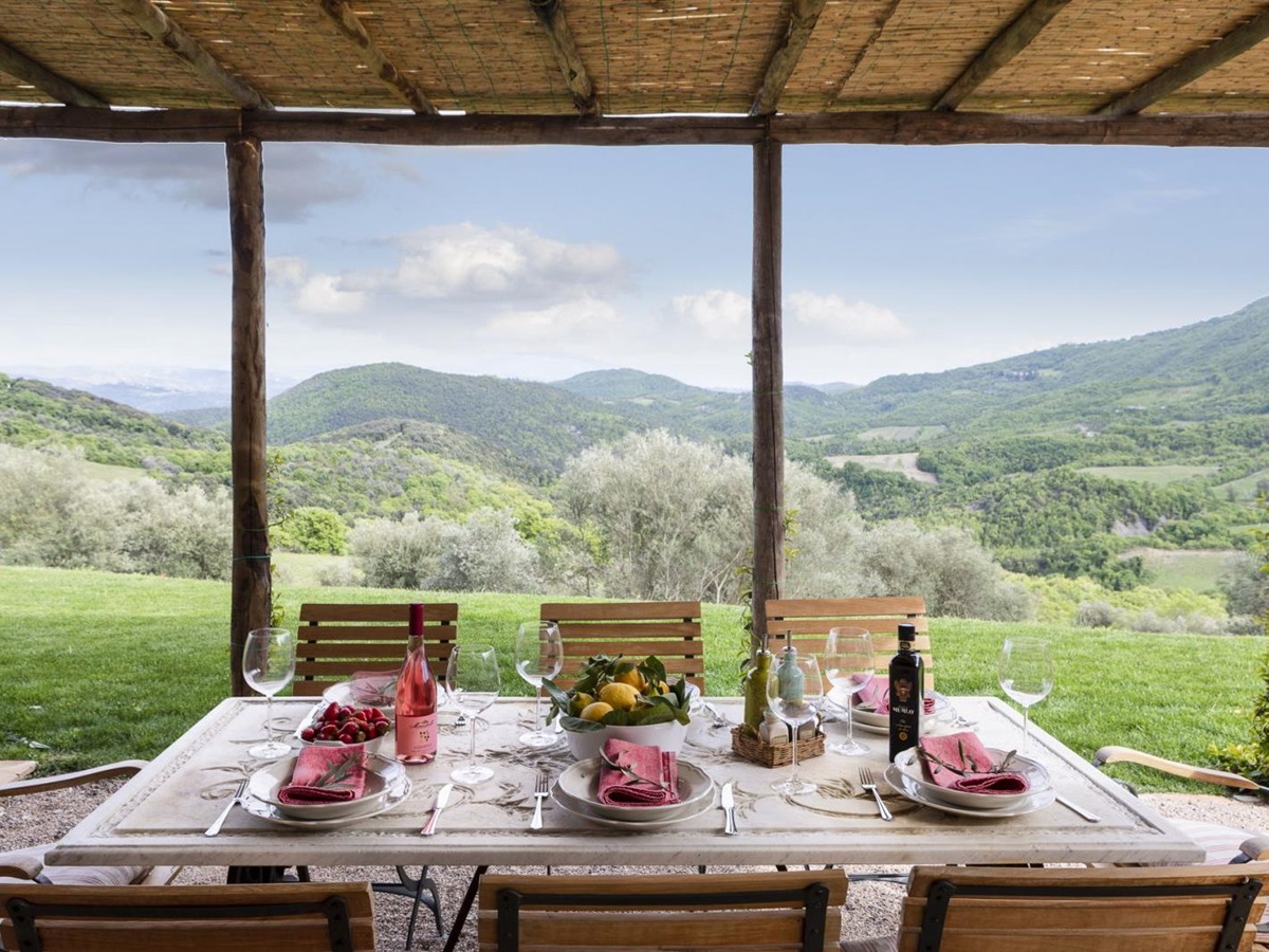 Dinner setup outside with a stunning view at Bel Canto, Umbria