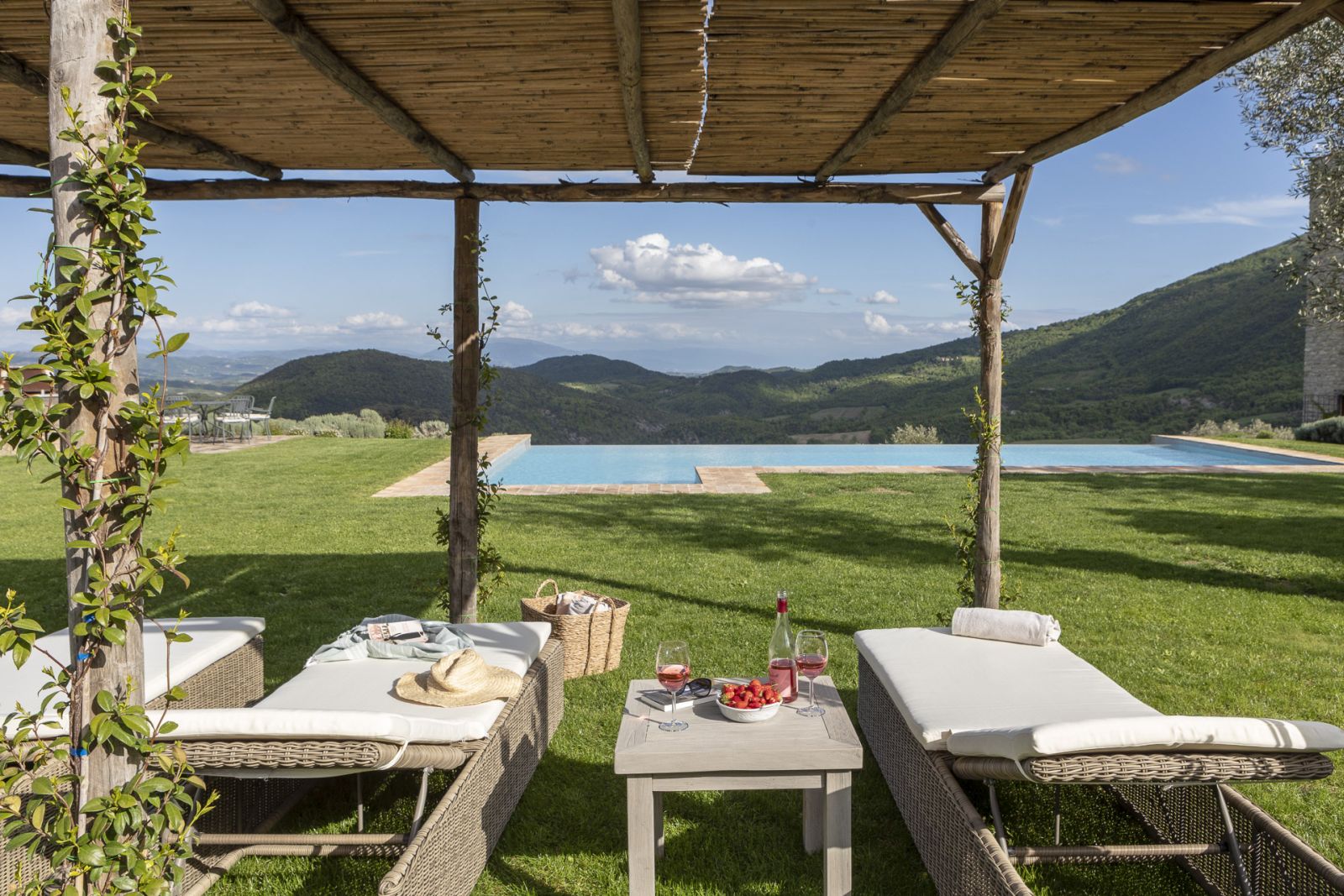 View of the pool from sun loungers at Bel Canto, Umbria 