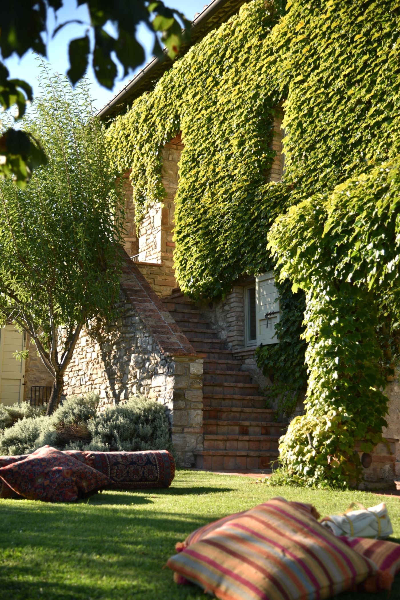 An exterior shot of Villa il Falco, including an external staircase.