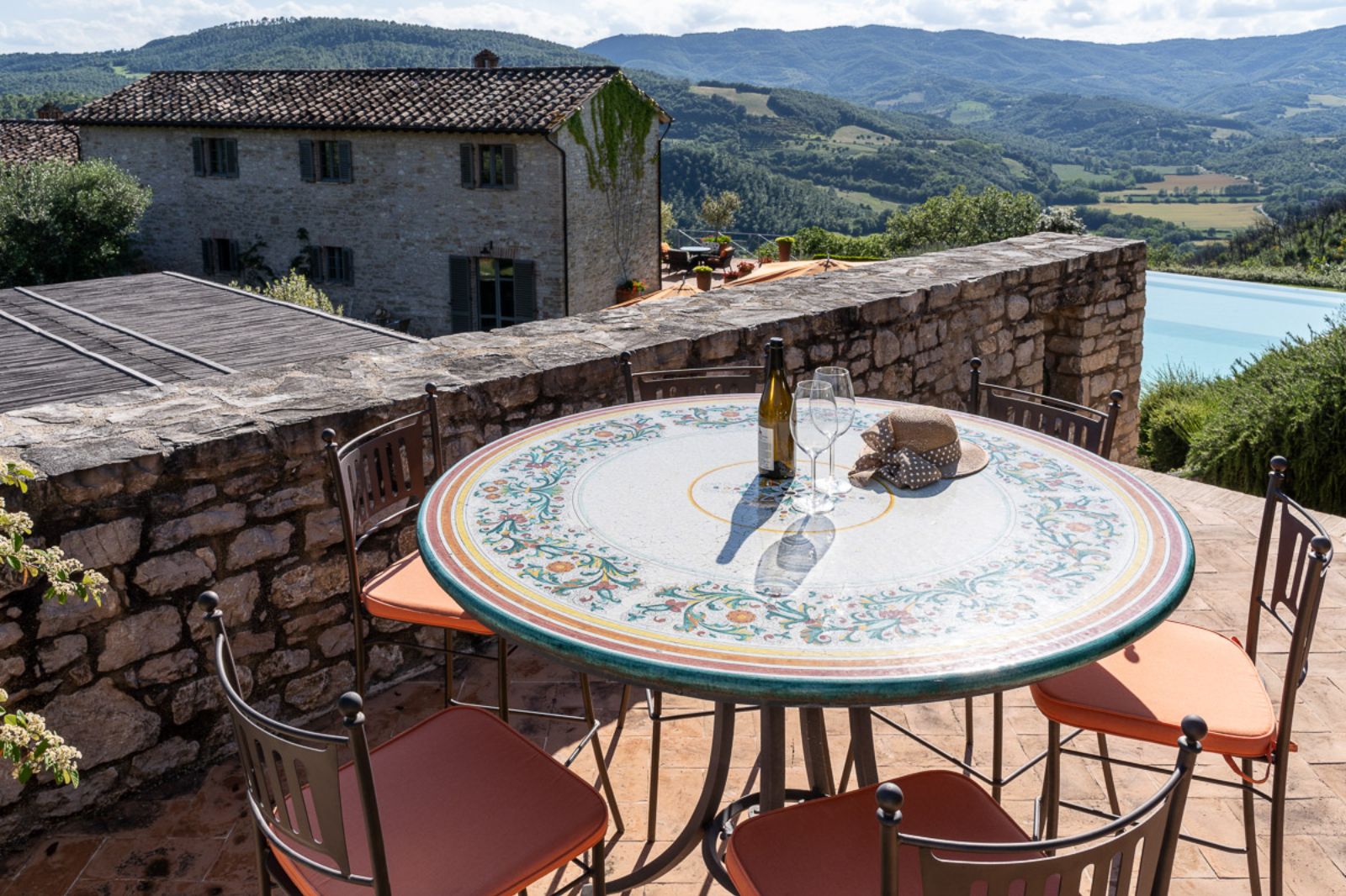 Outdoor seating at La Cascinale with countryside views