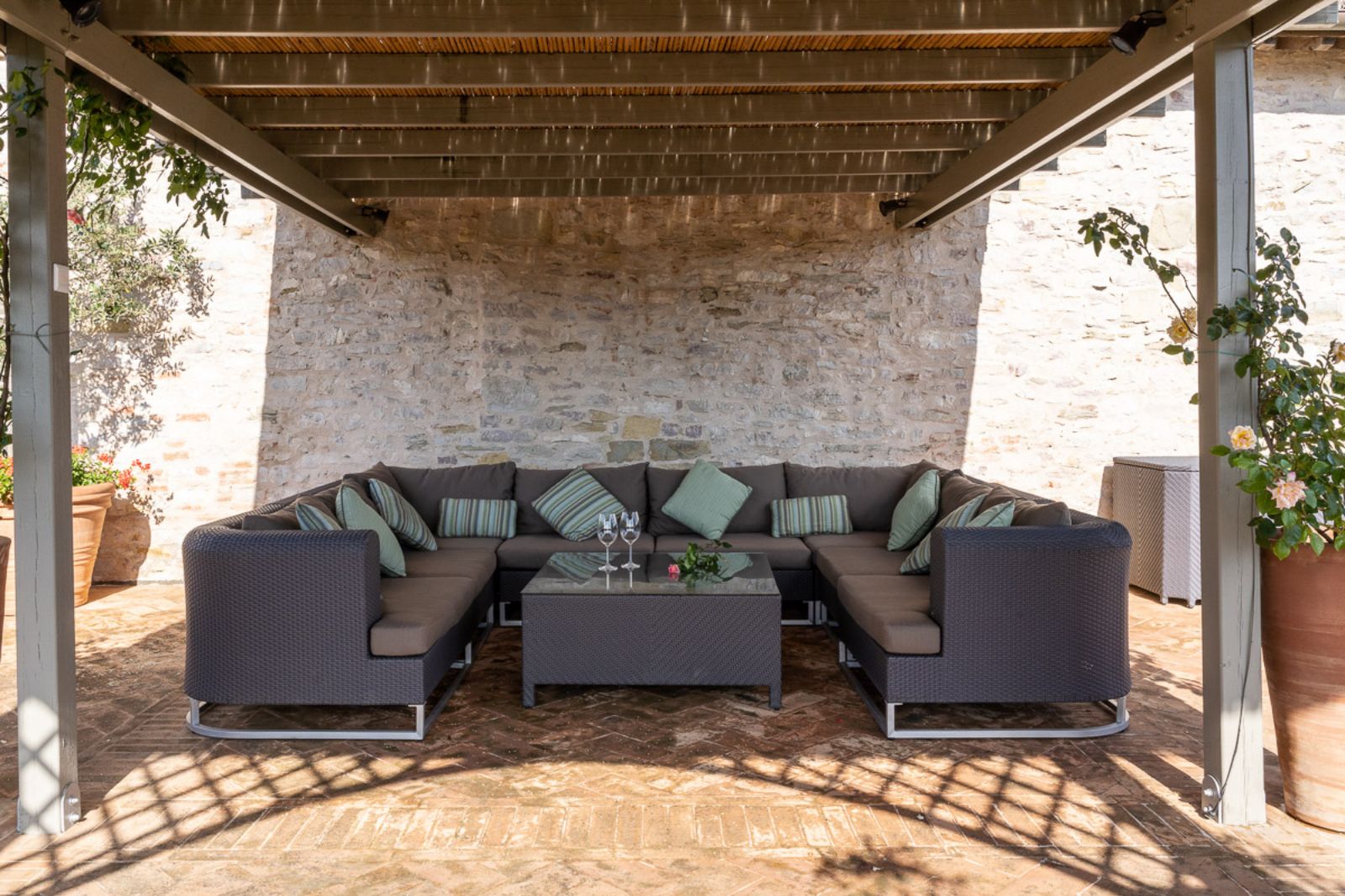 Outdoor covered seating area at La Cascinale