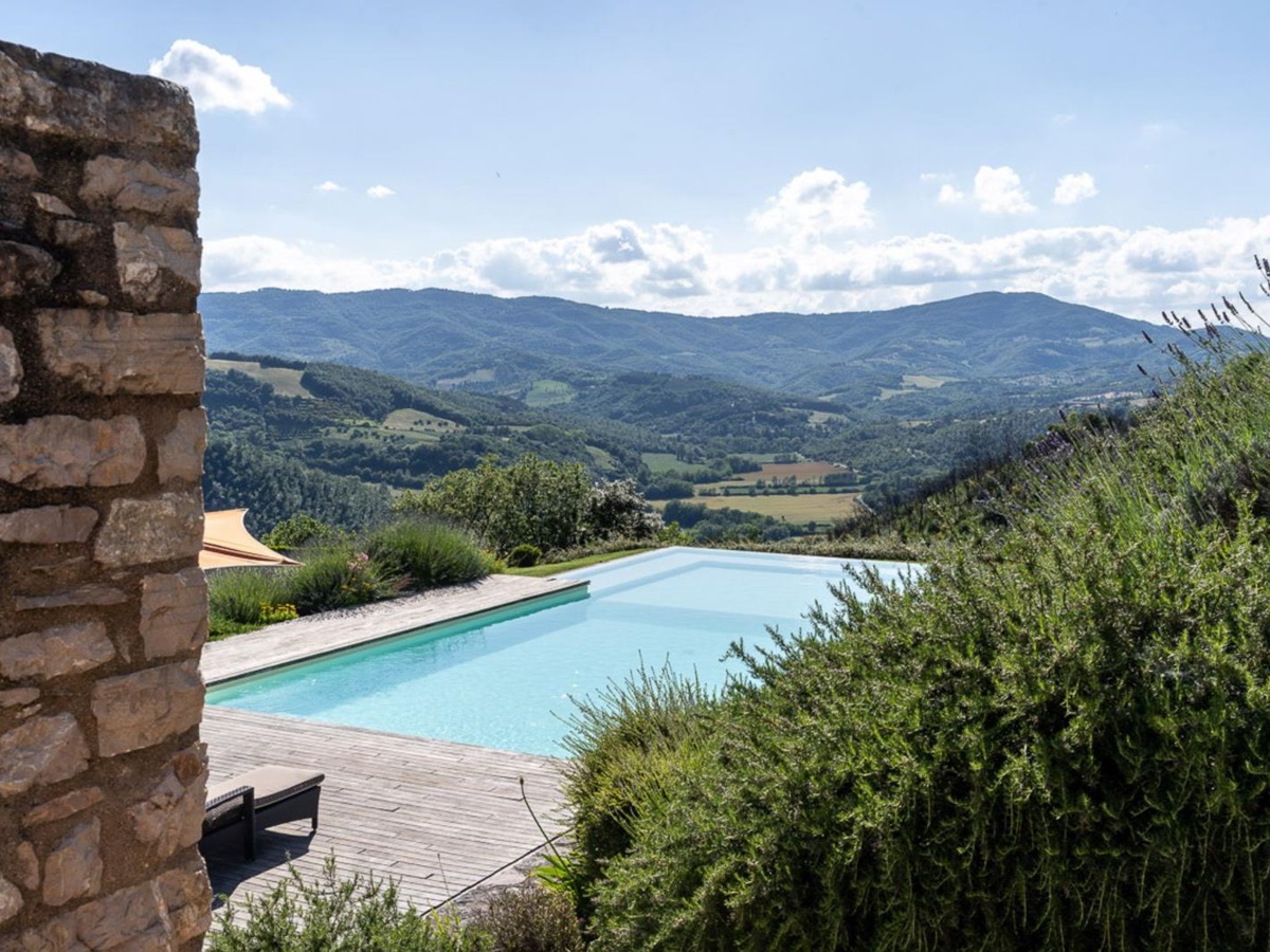 View of pool and countryside at La Cascinale