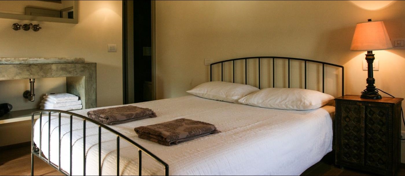 A King-sized bed in the second bedroom of La Spighetta.