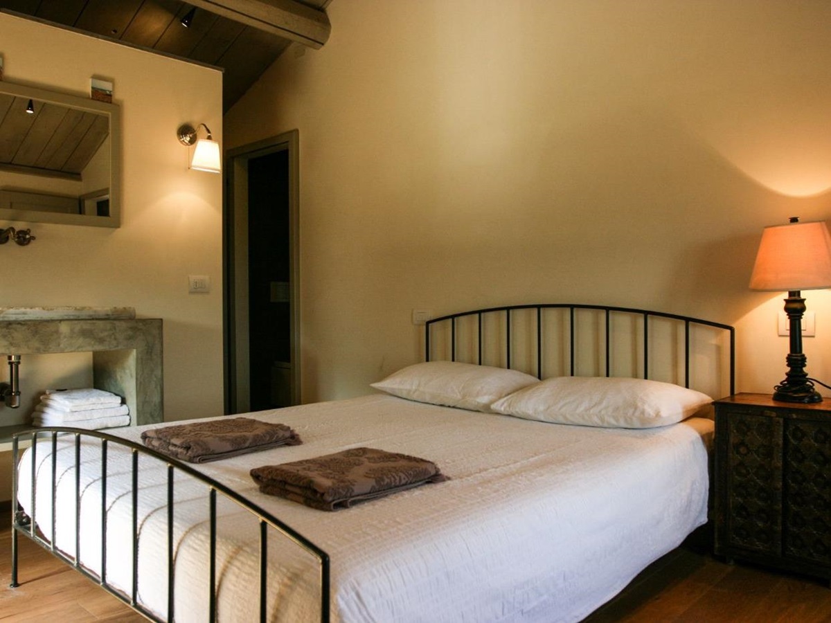 A King-sized bed in the second bedroom of La Spighetta.