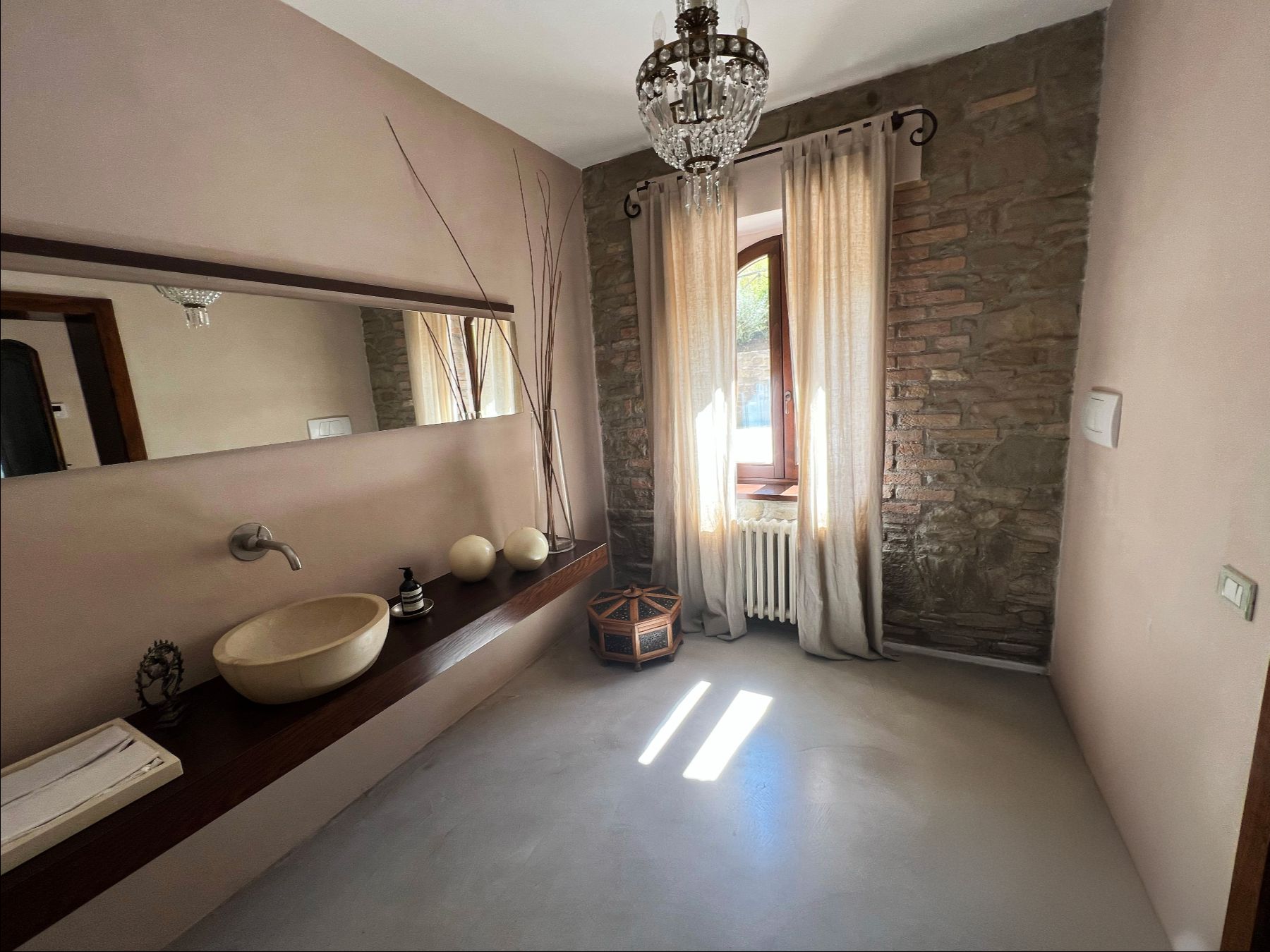 Beige and stone bathroom at L'Eremo in Umbria