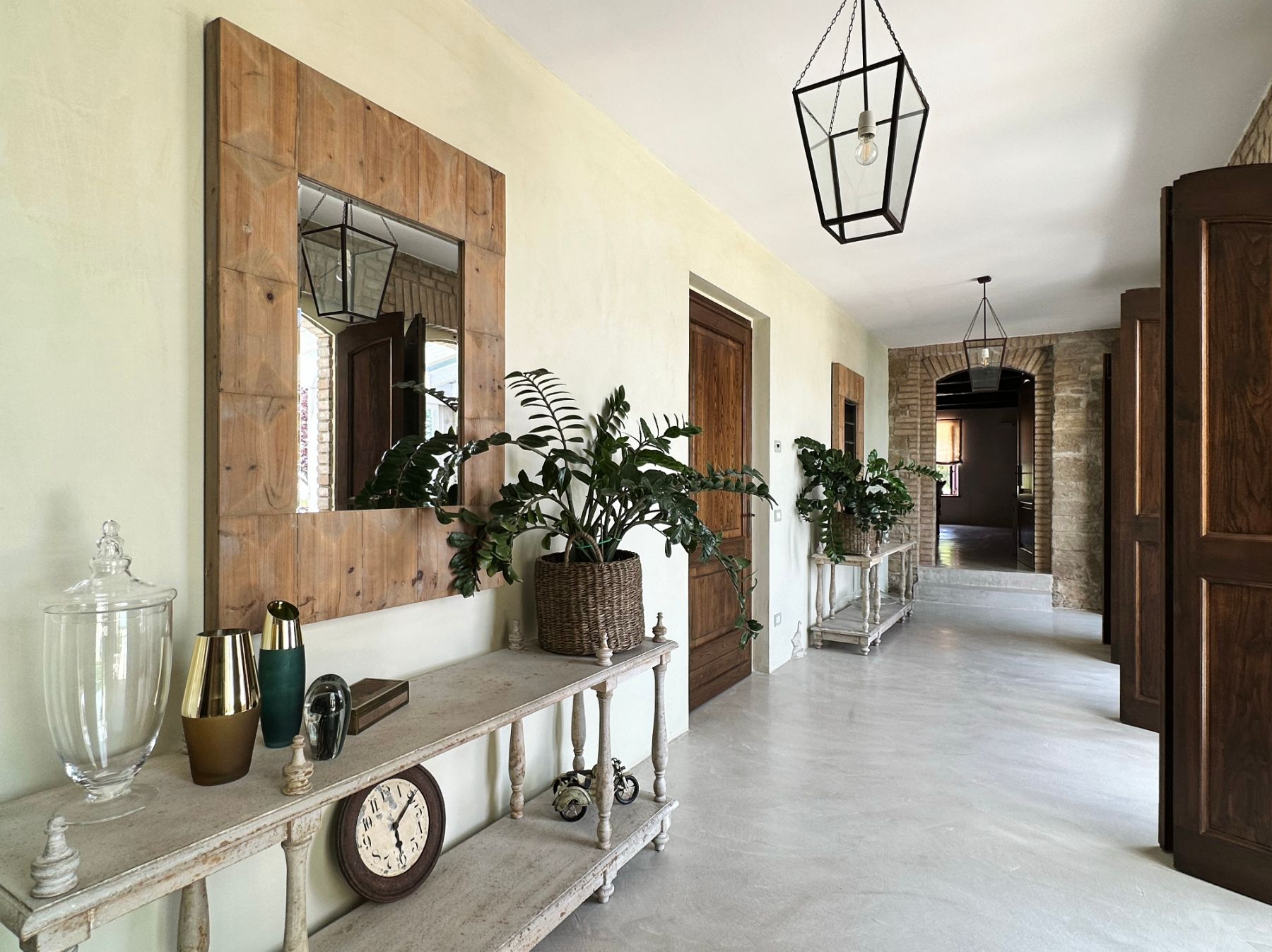 Hallway with plants at L'Eremo in Umbria