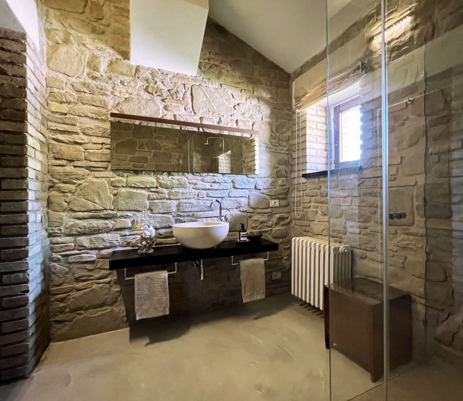 Stone wall bathroom at L'Eremo in Umbria