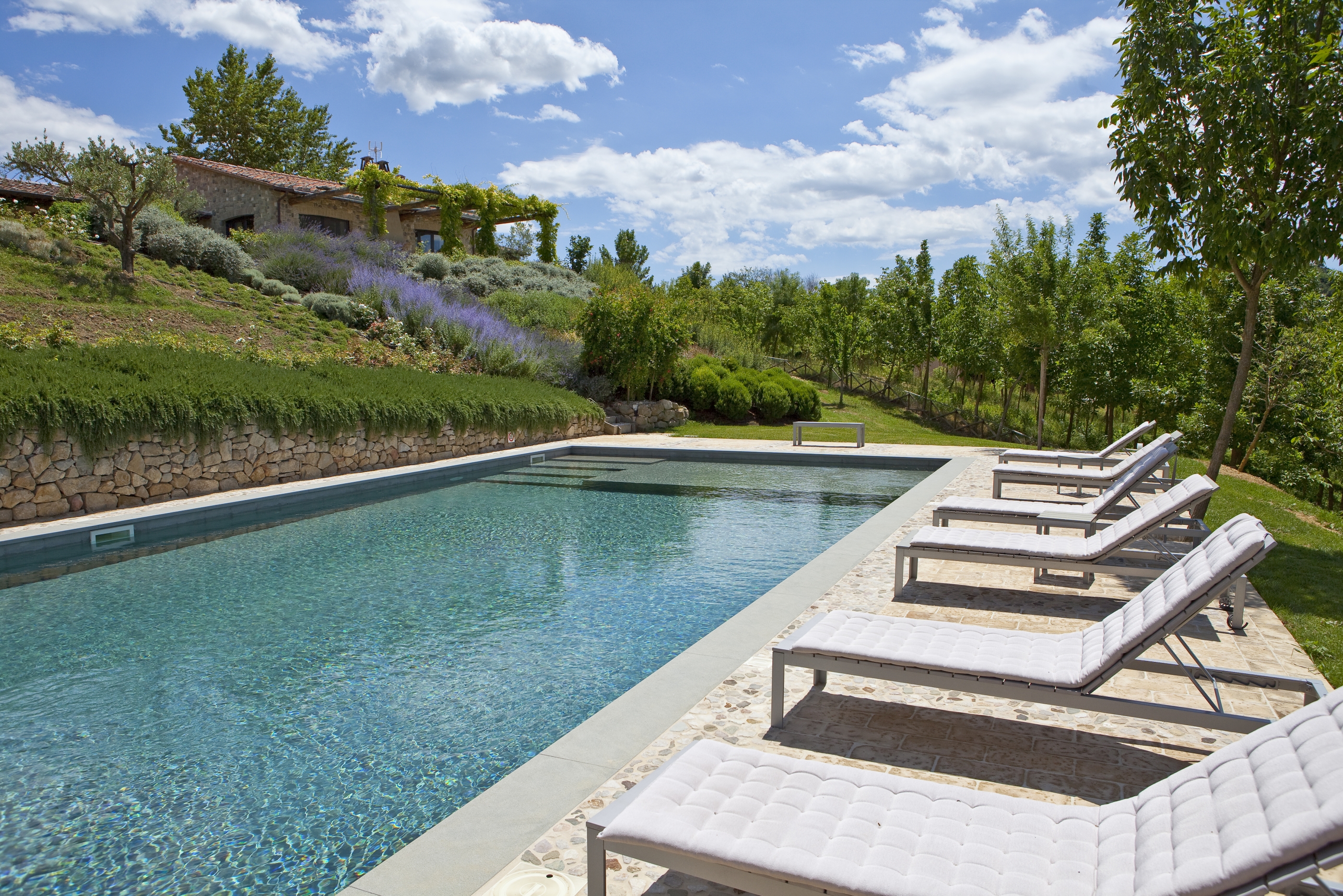 Swimming pool and facade of Mandola Piccola, umbria