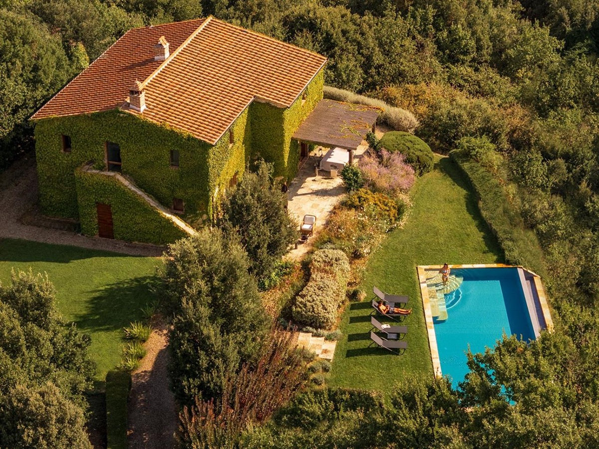 View of the side of Villa Monticello surrounded by trees as well as the outdoor pool