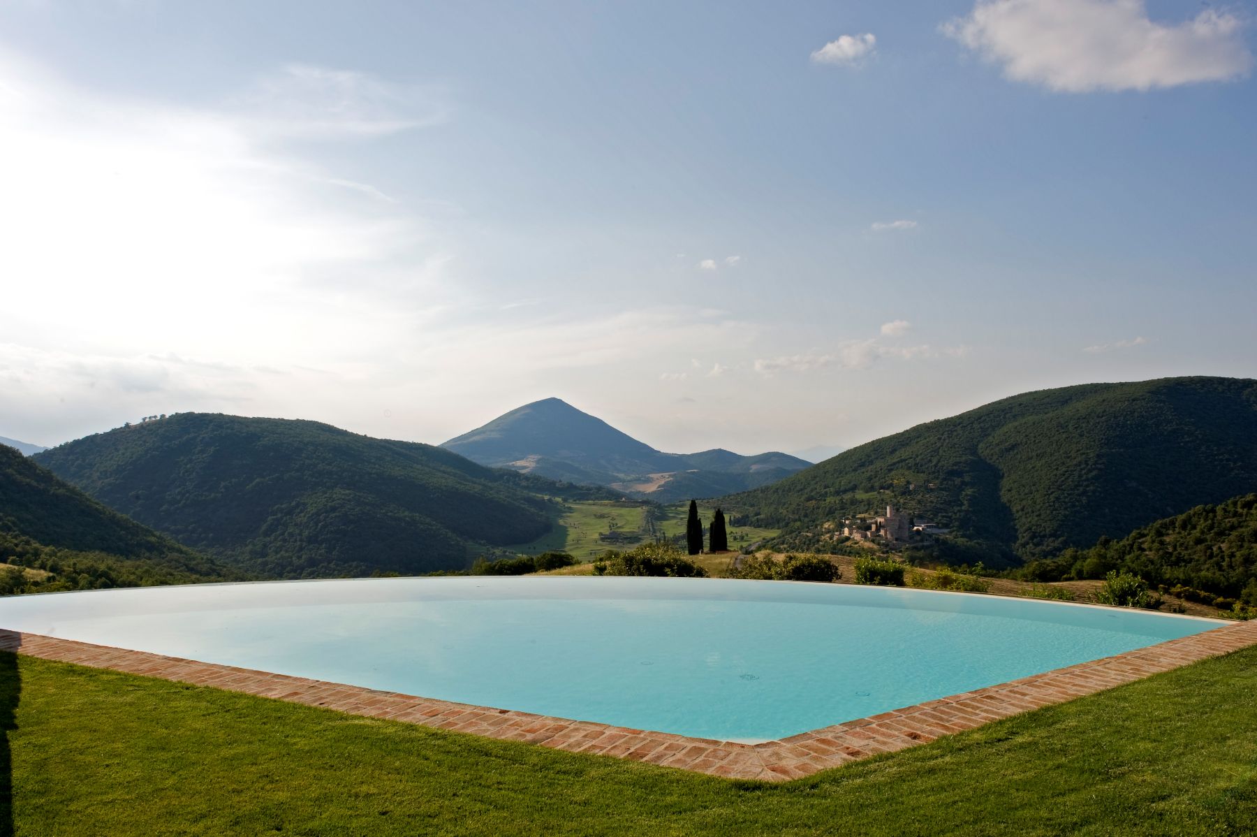Swimming pool and views across the Umbrian Countryside at Villa Arpeggio in Umbria