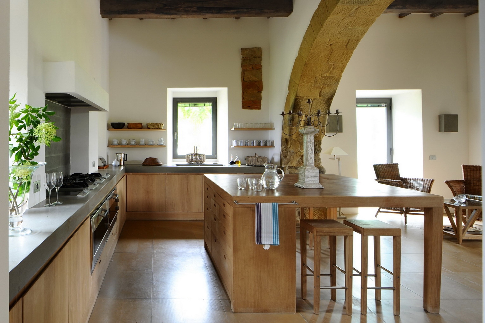 Kitchen with arched ceiling and large island surface at Villa Arrighi in Umbria
