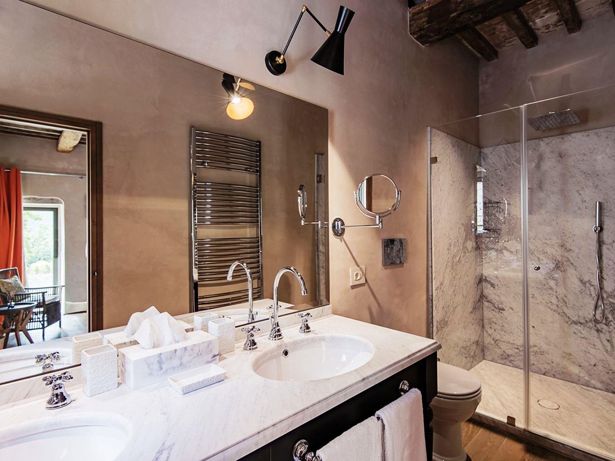 Bathroom with two sinks and big walk in shower at Villa Piuma in Umbria, Italy