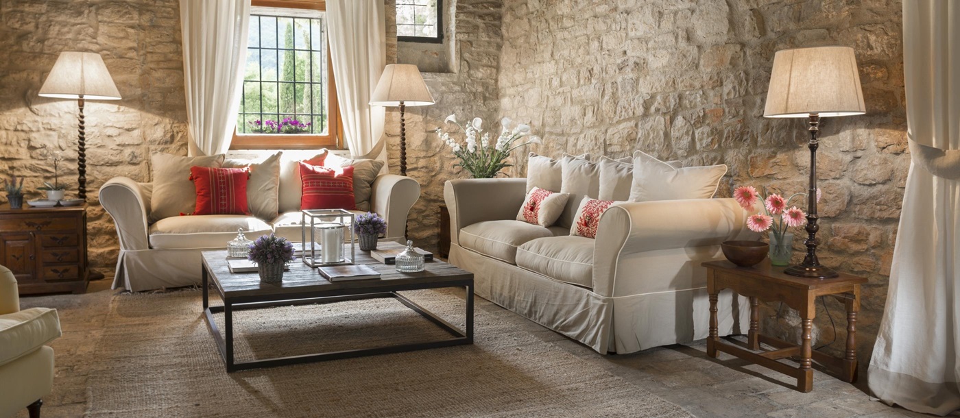 The stone-walled living room of Villa la Lavanda, Umbria