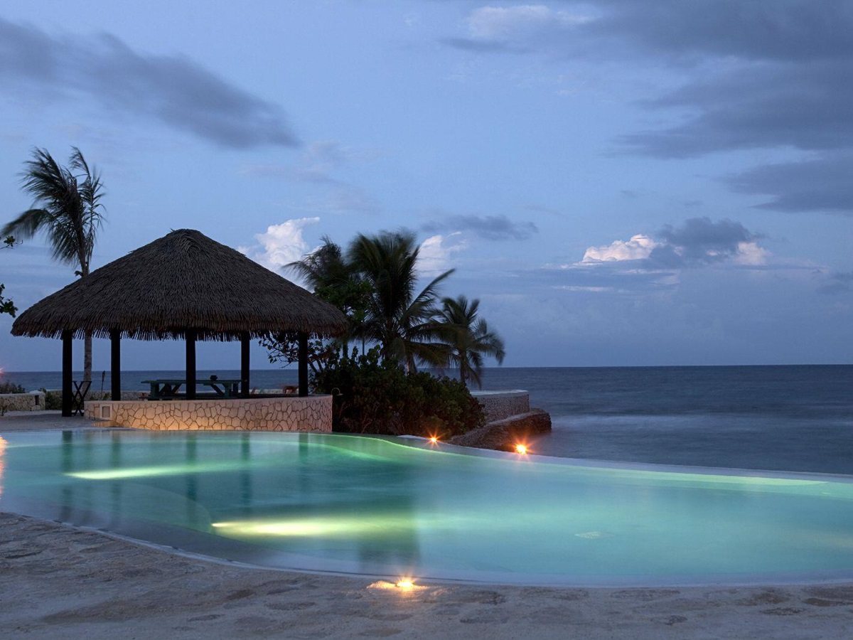 Swimming pool at GoldenEye Jamaica at dusk