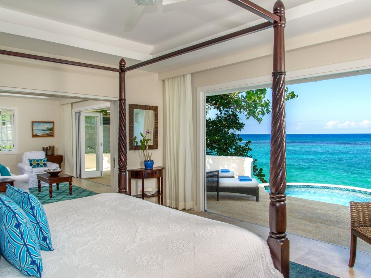 A bedroom and sea view at Jamaica Inn