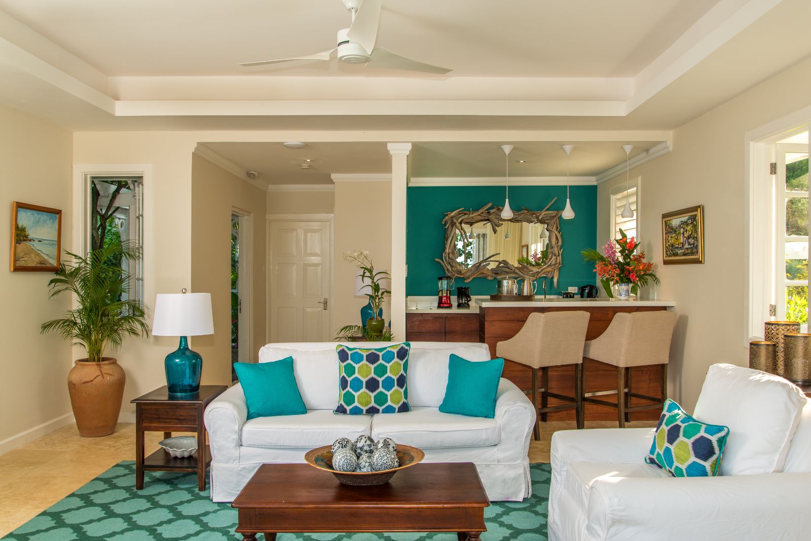 Living area of a cottage with a small bar at luxury resort Jamaica Inn in Jamaica