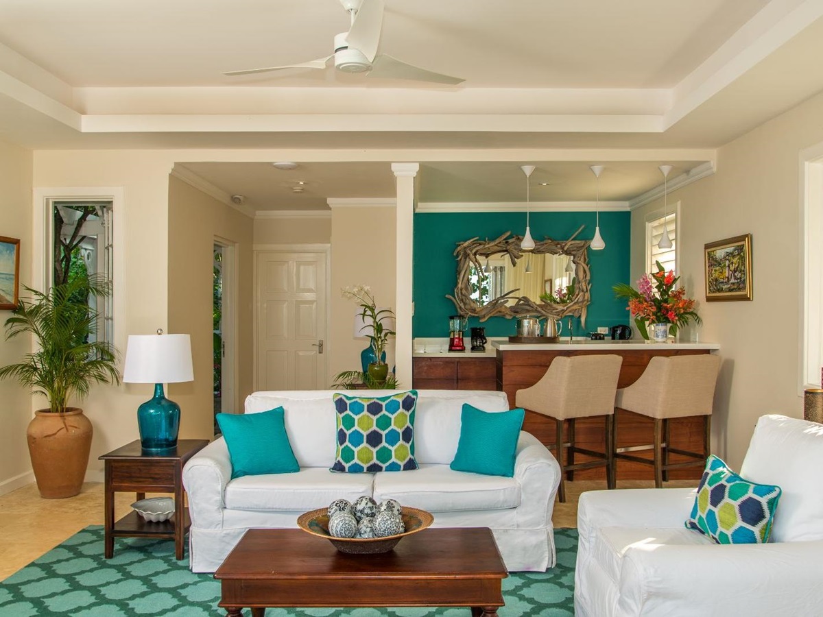 Living area of a cottage with a small bar at luxury resort Jamaica Inn in Jamaica