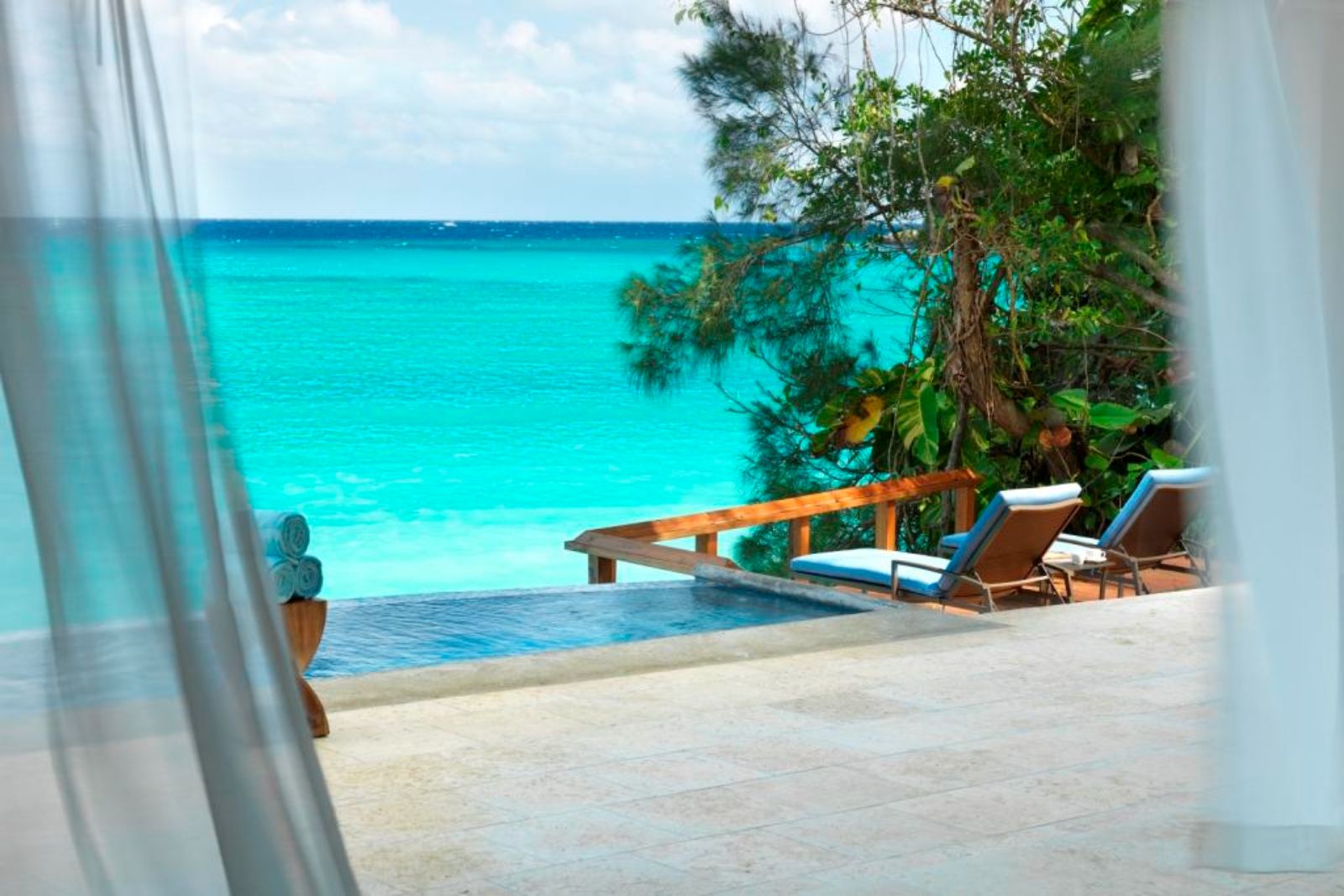View of the private pool and ocean at luxury resort Jamaica Inn in Jamaica