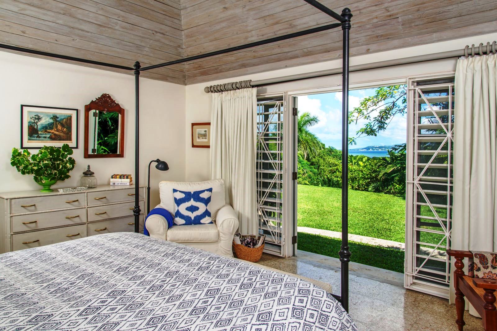 couble bedroom with patio doors at Almond Hill Villa, Montego Bay Jamaica
