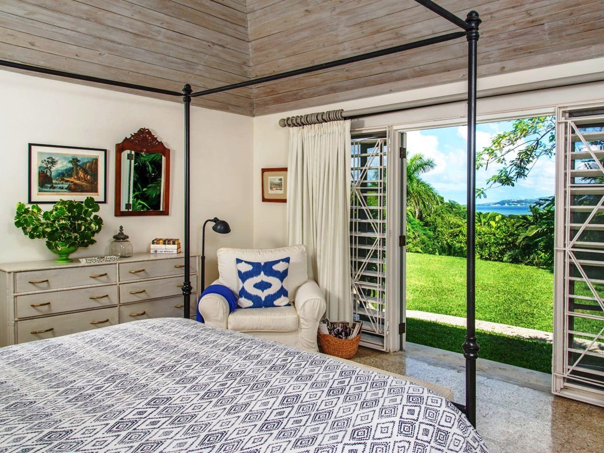 couble bedroom with patio doors at Almond Hill Villa, Montego Bay Jamaica