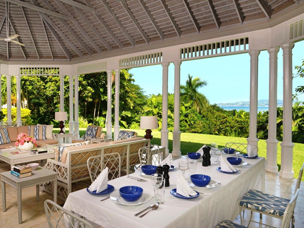 dining and seating area with views over the garden and hills at Almond Hill Villa, Montego Bay Jamaica