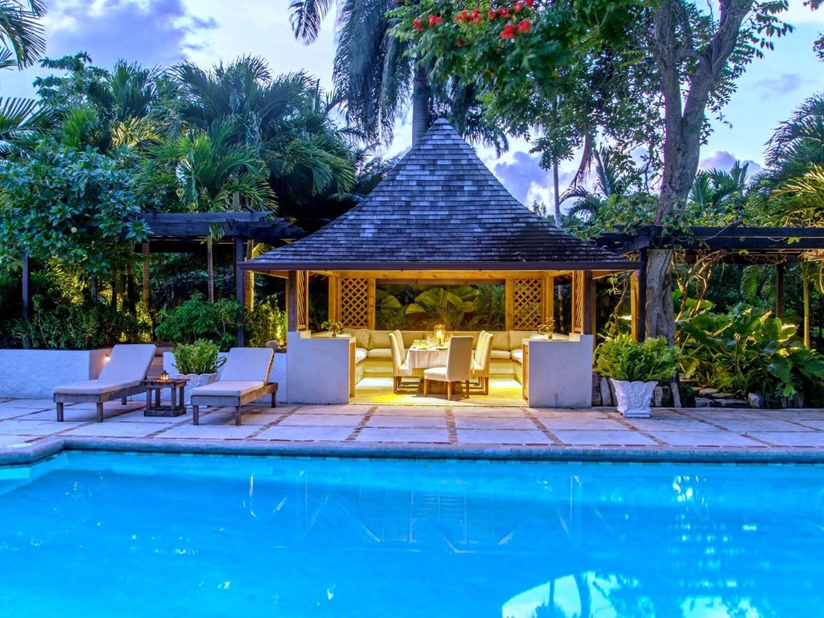 pool with gazebo behind lit up at night at Almond Hill Villa, Montego Bay Jamaica