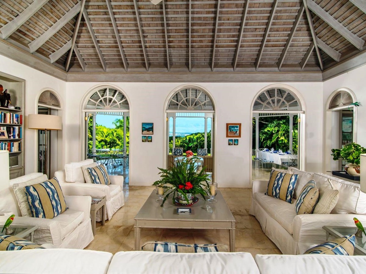 seating area with white sofas and coffee table at Almond Hill Villa, Montego Bay Jamaica