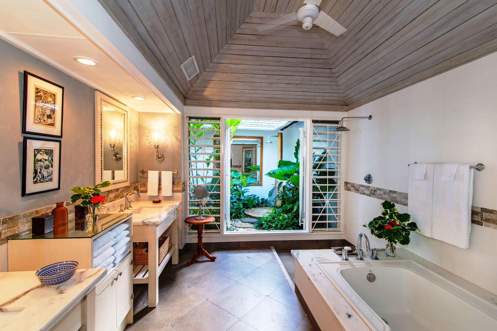 bathroom with tub and outdoor shower at Almond Hill Villa, Montego Bay Jamaica