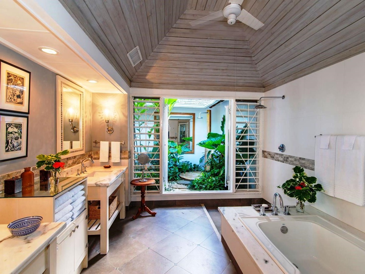 bathroom with tub and outdoor shower at Almond Hill Villa, Montego Bay Jamaica