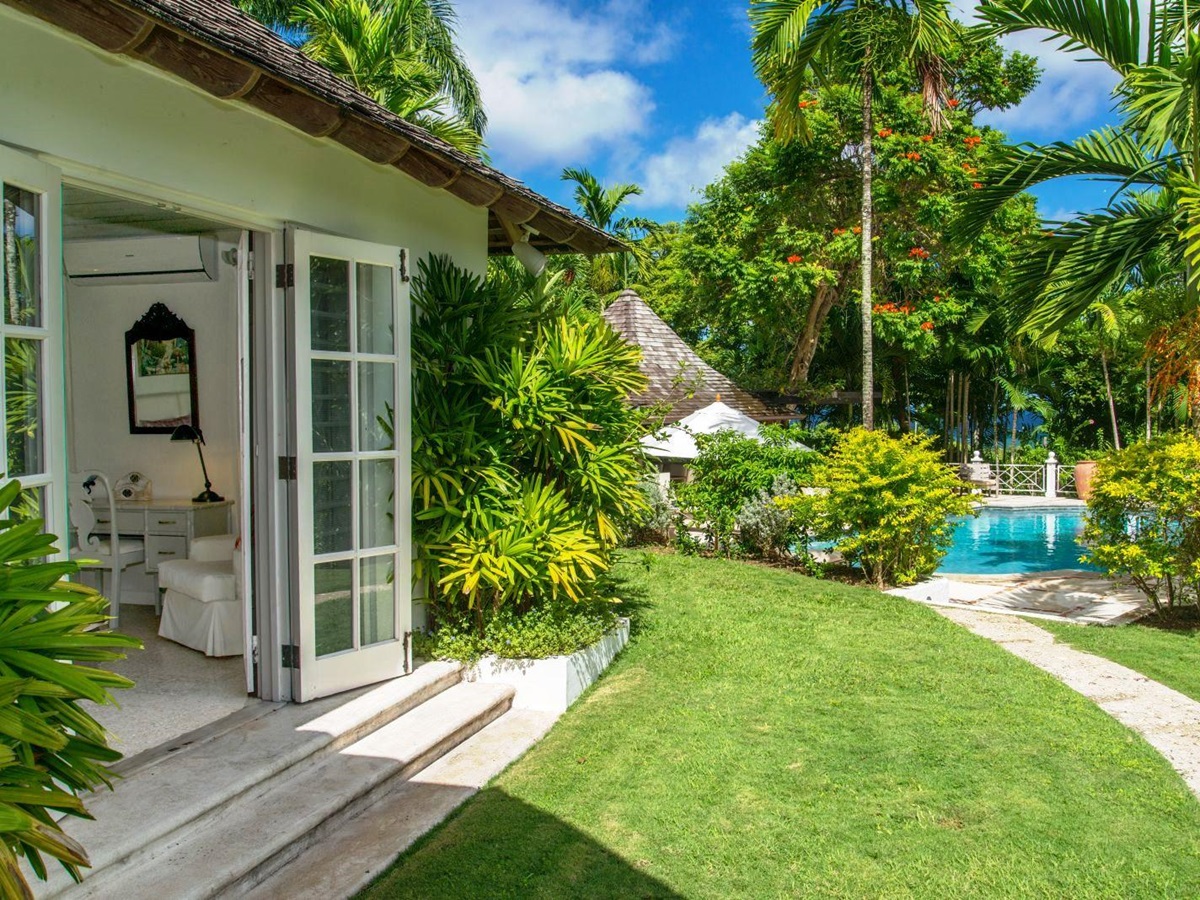 garden path next to house leading to pool at Almond Hill Villa, Montego Bay Jamaica