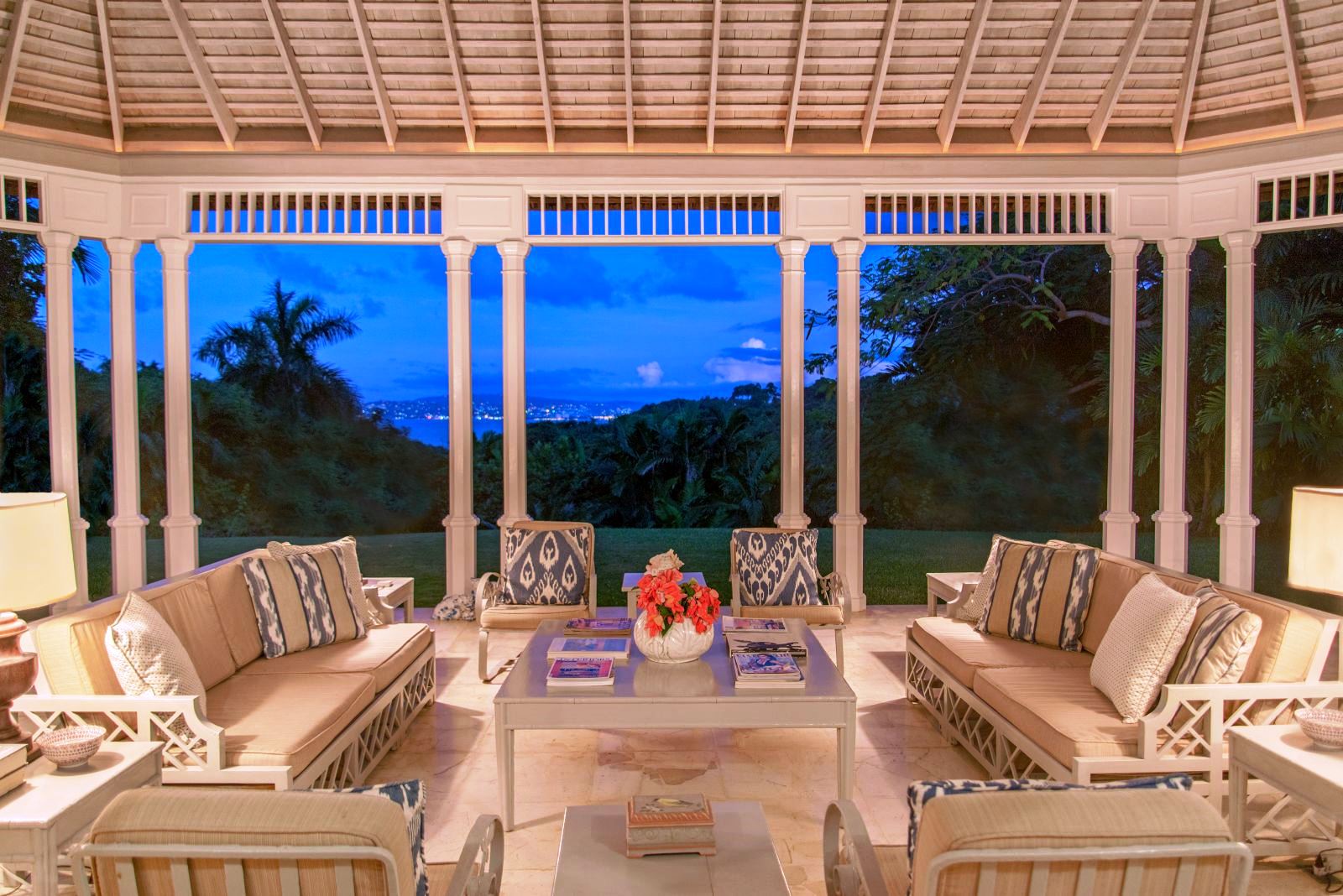 sitting area with comfy furniture on marble floor and views over Montega Bay, Jamaica